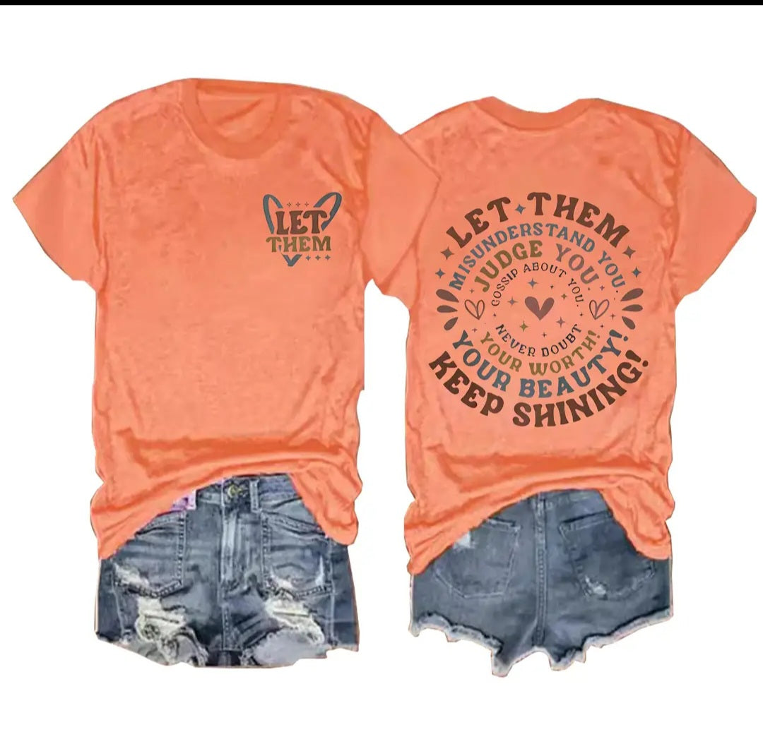 "Let Them" tee in orange.