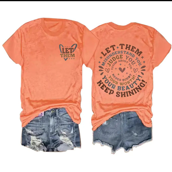 "Let Them" tee in orange.