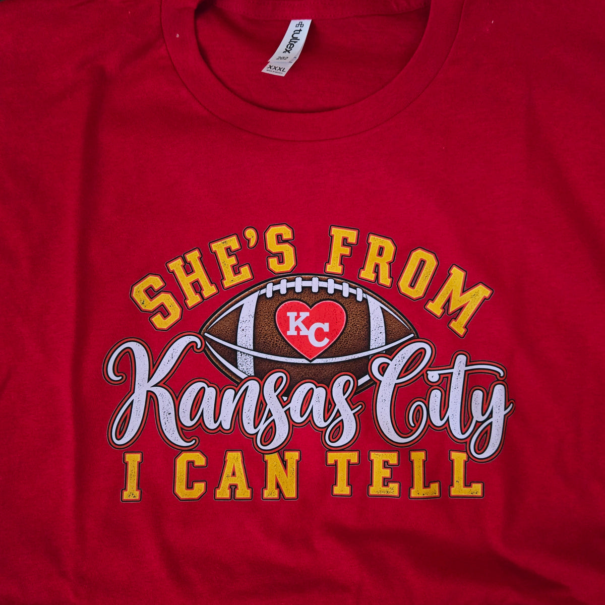 She's from Kansas City red tee